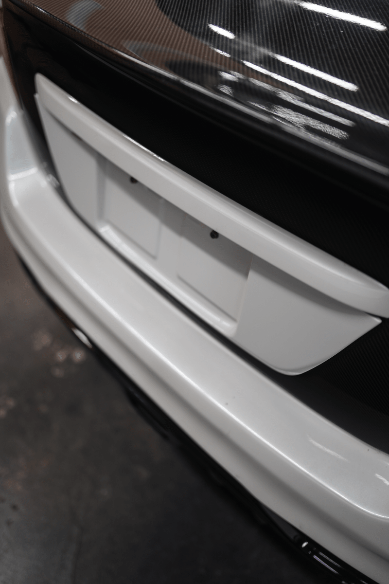JDMuscle [15-21 WRX/STI] Gloss Black / Paint Matched License Plate Backing