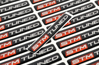 STM Tuned Badge